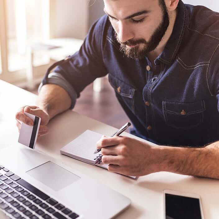 man paying a bill online