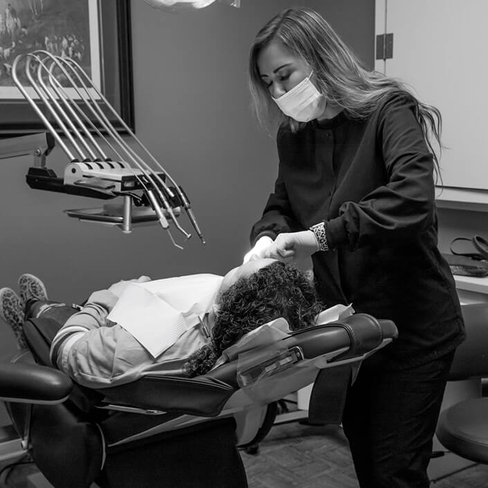 staff member working with a patient