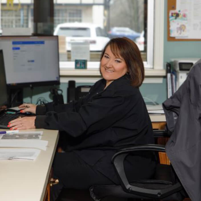 Dena at the front desk