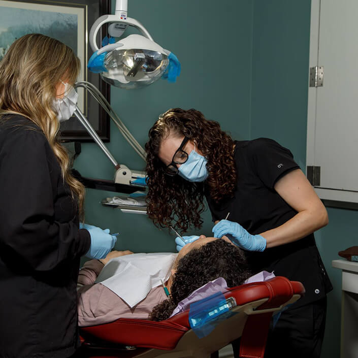 staff members working with a patient