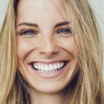 woman smiling big with a bright smile after professional teeth whitening