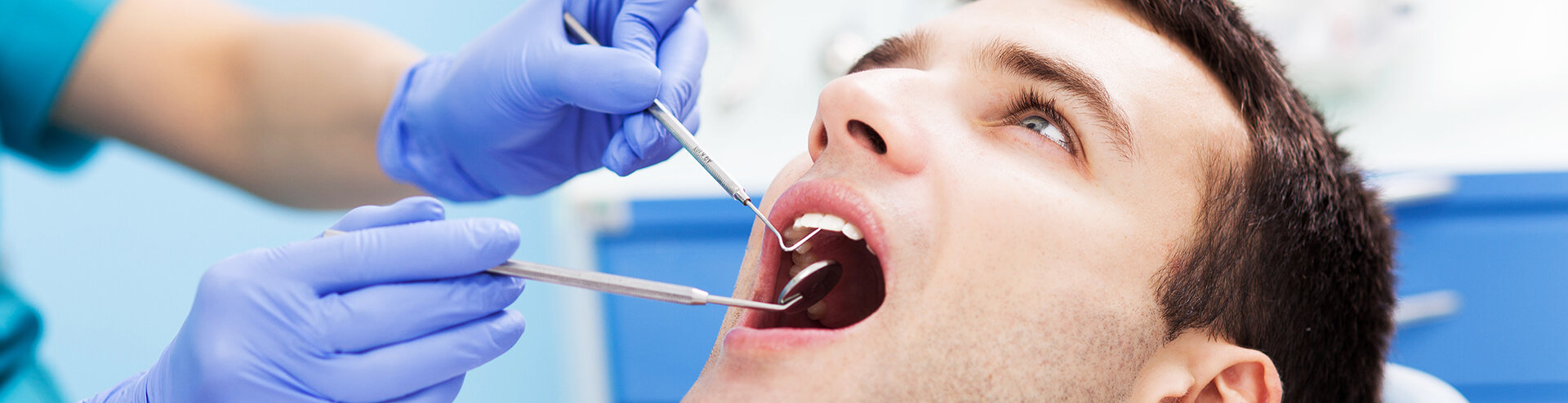 man receiving a dental exam