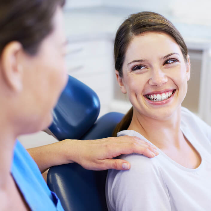 woman smiling from dental chair