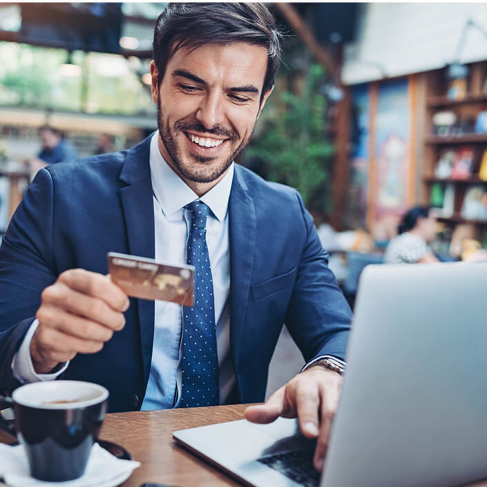 smiling man paying bill