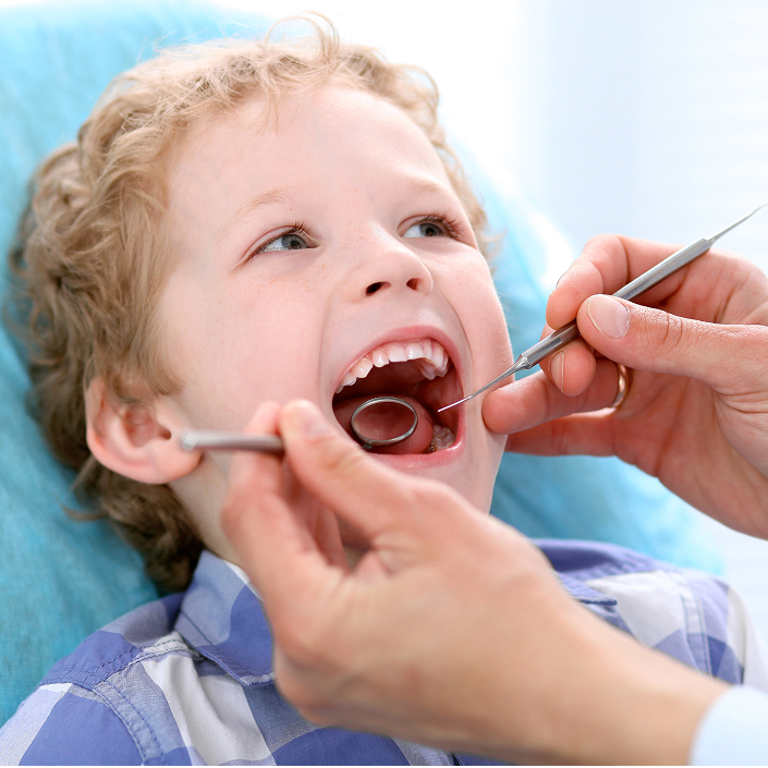 young boy at the dentist