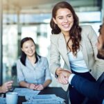 business woman smiling confidently, benefits of cosmetic dentistry