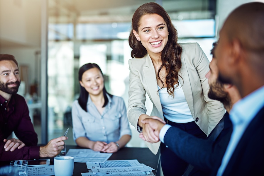 business woman smiling confidently, benefits of cosmetic dentistry